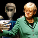 Image for article titled Why Is Angela Merkel Always Palling Around With Robots?